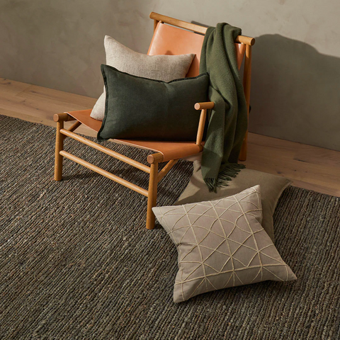 Suffolk Mineral jute rug styled in a dining room setting