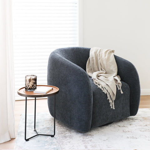 Ted swivel chair in steel grey textured polyester, styled in a living room