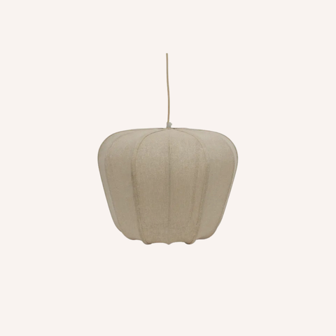 A modern pendant light with a textured, ribbed fabric shade in a light beige or oatmeal color, suspended by a thin cord against a solid off-white background.
