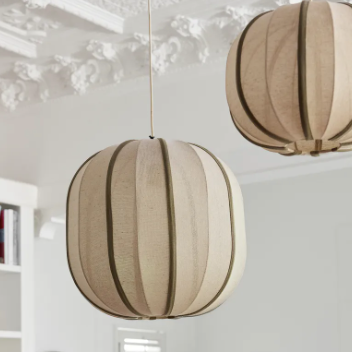 Thea Oval Pendant styled in a room setting, olive and natural