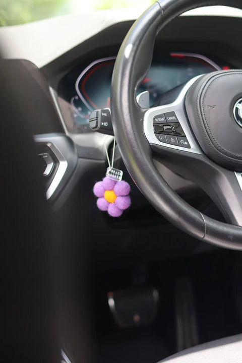 Tiger Lily & Jasmine felt flower car air freshener on steering wheel