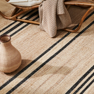 Umbra Rug in natural jute, flatweave with black stripe pattern