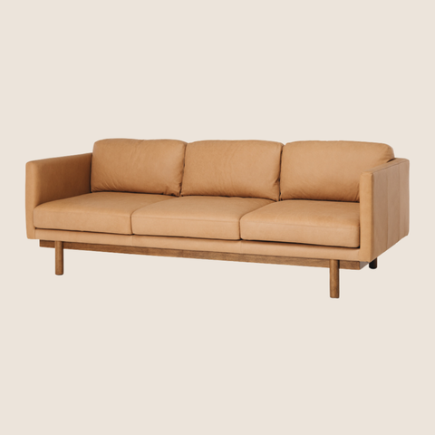 Valencia full-grain aniline leather sofa in tan, slim architectural silhouette, front view
