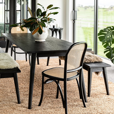 Vanessa dining table in Matte Black, styled in a dining room