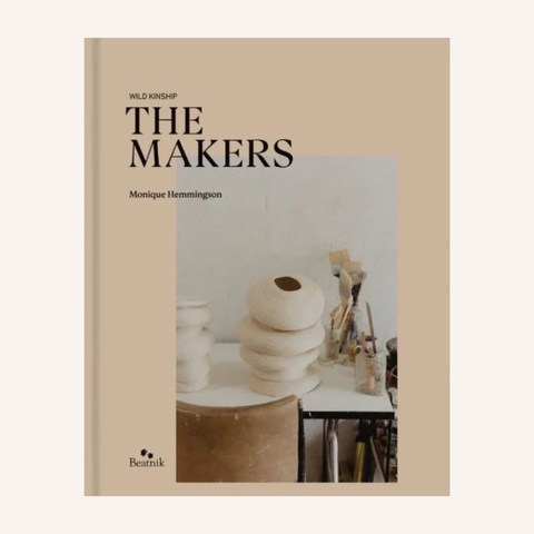 The Makers book cover by Monique Hemmington, published by Beatrix. The cover features a warm beige background with the title in bold black text and a central photograph of stacked ceramic vessels on a table.