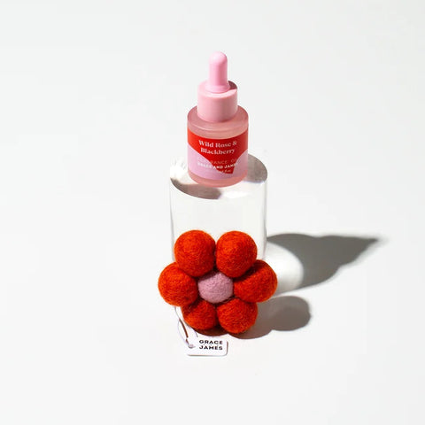 Wild Rose & Blackberry fragrance dropper bottle with felt flower diffuser