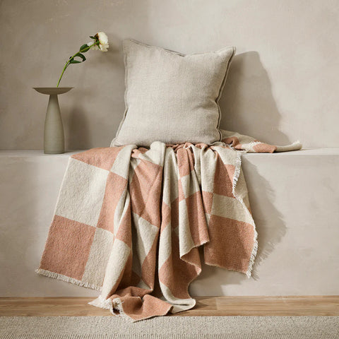 Winton Coral Throw styled on a bench seat