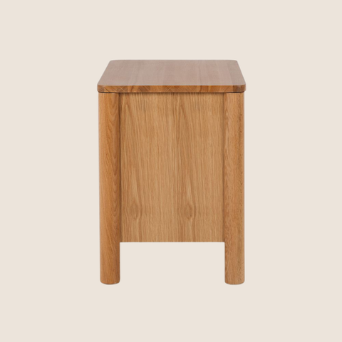 Yumi bedside table close-up showing handleless drawer and curved edge
