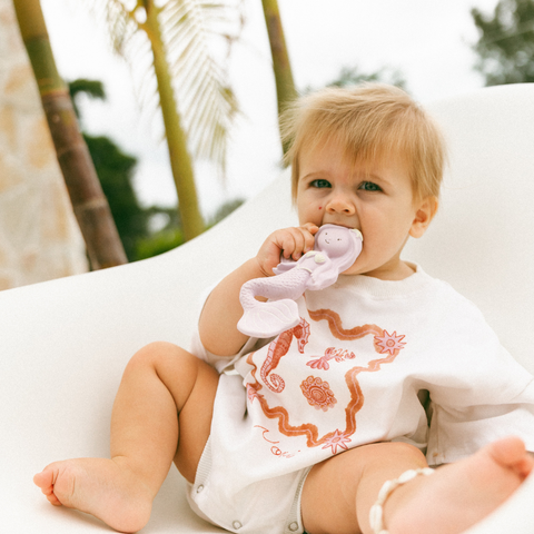 baby holding teether - natural rubber texture on mermaid teether