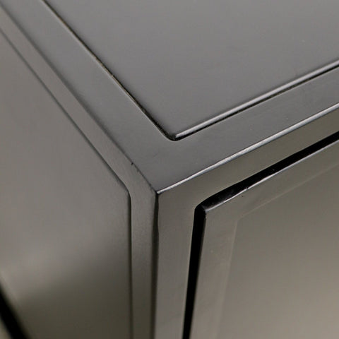 Close-up of a metallic cabinet corner with a reflective finish