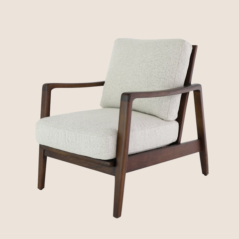 contemporary pumice fabric armchair with walnut-stained oak frame and brass buckle backrest detail, front view