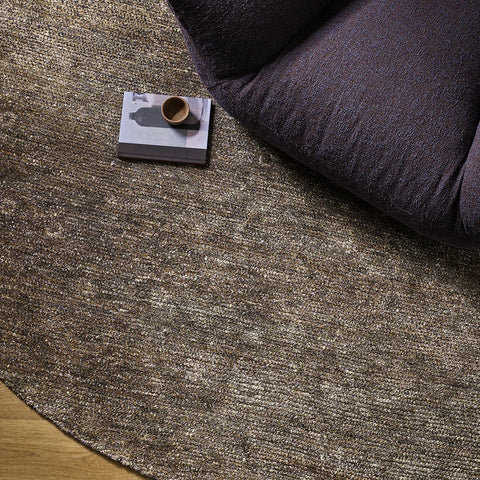Fairbanks Fossil Round Rug styled in a living room setting