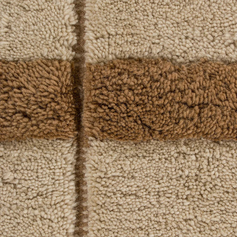 Close-up of Mesa Rug loop-pile texture, camel and brown tones