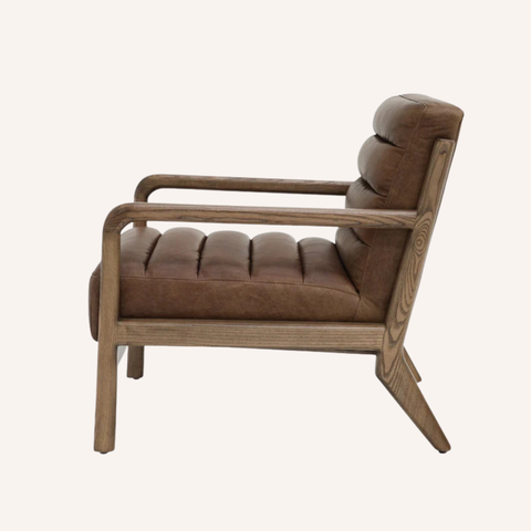 Moore Armchair side view showing low grounded ash wood frame and seat depth