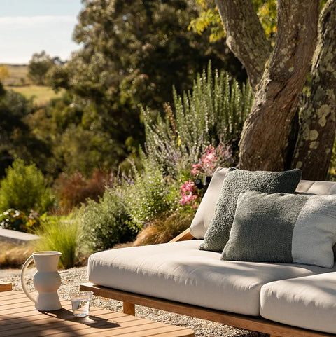 Piper Cushion in Eucalyptus styled outdoors on a garden chair