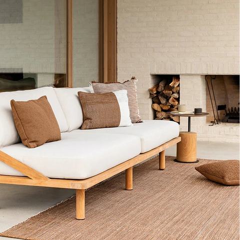 Piper Cushion in Tobacco styled outdoors on a garden chair