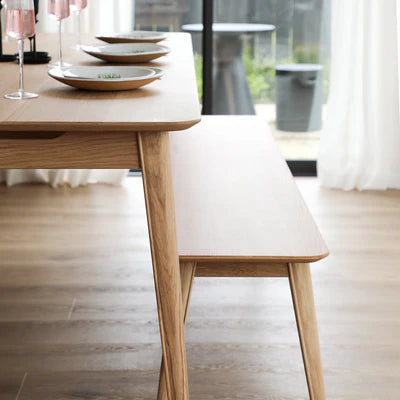 Reuke Bench Seat in Natural oak finish, styled in a dining room setting
