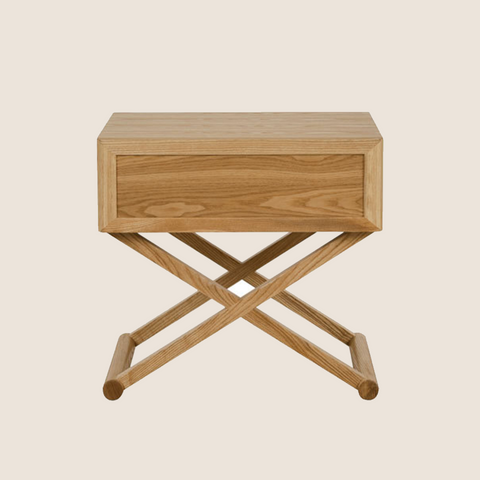 Mandy bedside table front view showing drawer and cross-leg frame